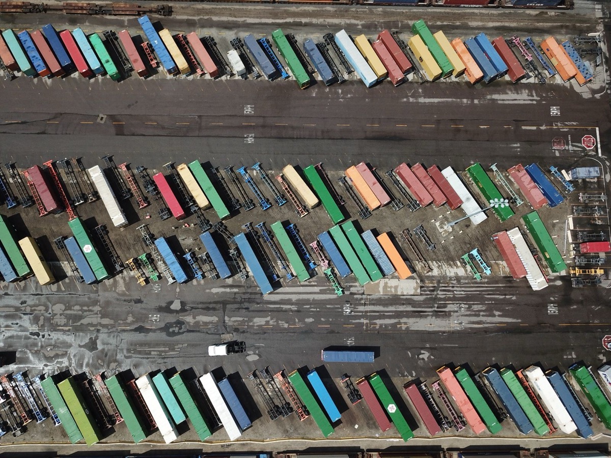 Rows of shipping containers in a yard, seen from above