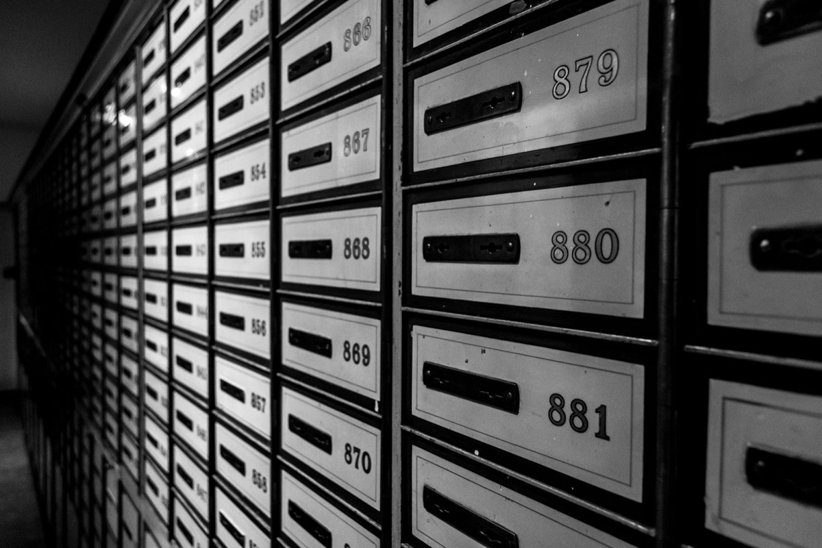 Rows of numbered metal letterboxes
